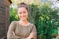 Young woman smiling outdoor. Beautiful brunete girl resting on park or garden green background. Free happy woman at Royalty Free Stock Photo