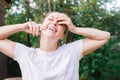 Young woman smiling outdoor. Beautiful brunete girl resting on park or garden green background. Free happy woman at Royalty Free Stock Photo