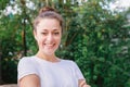 Young woman smiling outdoor. Beautiful brunete girl resting on park or garden green background. Free happy woman at Royalty Free Stock Photo