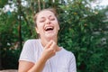 Young woman smiling outdoor. Beautiful brunete girl resting on park or garden green background. Free happy woman at Royalty Free Stock Photo