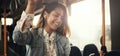 Smiling young woman riding on a bus listening to music Royalty Free Stock Photo