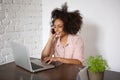 Young woman smiling and talking on cell phone Royalty Free Stock Photo