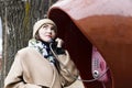 Young woman smiling and talking on a public phone Royalty Free Stock Photo