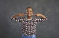 Portrait of happy young black woman pointing at her smile with perfect white teeth Royalty Free Stock Photo