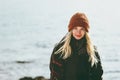 Young Woman smiling walking at winter sea Travel Fashion Lifestyle concept outdoor Royalty Free Stock Photo