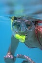 Young woman snorkeling.