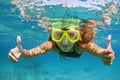 Young woman in snorkeling mask dive underwater with tropical fishes Royalty Free Stock Photo