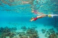 Young woman in snorkeling mask dive underwater with tropical fishes Royalty Free Stock Photo