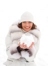 Young woman with a snowball