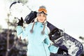 Young woman with snowboard Royalty Free Stock Photo