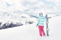 Young woman with snowboard