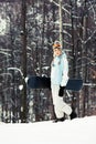 Young woman with snowboard on ski slope Royalty Free Stock Photo