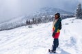 Young woman snowboarder goes to the mountains Royalty Free Stock Photo