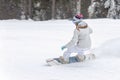 Young woman snowboarder in motion on snowboard in mountains Royalty Free Stock Photo