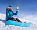 Young woman snowboarder in mountains Royalty Free Stock Photo