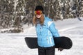 Young woman snowboarder with snowboard Royalty Free Stock Photo