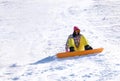 Young woman snowboarding on hill. Winter Royalty Free Stock Photo