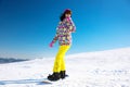 Young woman snowboarding on hill. Winter Royalty Free Stock Photo