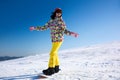 Young woman snowboarding on hill. Winter vacation Royalty Free Stock Photo