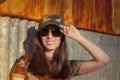 Young Woman Soldier in Camouflage Outfit Saluting Royalty Free Stock Photo