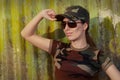 Young Woman Soldier in Camouflage Outfit Saluting Royalty Free Stock Photo