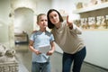 Woman and boy observing sculptures exhibition Royalty Free Stock Photo