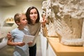 Woman and boy observing sculptures exhibition Royalty Free Stock Photo