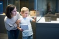 Woman and boy visiting sculptures exhibition Royalty Free Stock Photo