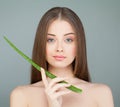 Young Woman Spa Model and Green Aloe Leaf