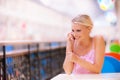 Young woman speaks by phone