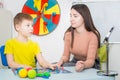 Young woman speech therapist is engaged in the office with a child