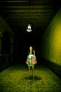 Young woman in spooky corridor