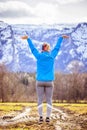 Young woman in sportswear is standing on a field, wonderful-gesture