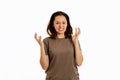 A young woman spread her hands in exasperation and clenched her teeth. White background. The concept of psychological