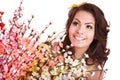 Young woman with spring flower and butterfly. Royalty Free Stock Photo