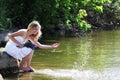 Young woman sprinkles water