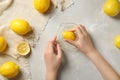 Young woman squeezing lemon with juicer Royalty Free Stock Photo