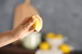 Young woman squeezing lemon Royalty Free Stock Photo