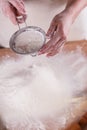 Young woman squirting a flour in an apron