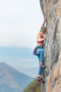 Young woman stairs a wall during a rock course Royalty Free Stock Photo