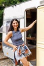 Young woman stand in front of motorhome Royalty Free Stock Photo