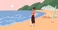 Young woman standing on beach and enjoying marine view and summer sunset at sea. Happy female character looking at ocean