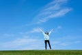 Young woman standing in field of green grass Royalty Free Stock Photo