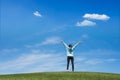 Young woman standing in field of green grass Royalty Free Stock Photo