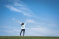 Young woman standing in field of green grass Royalty Free Stock Photo