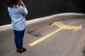 Young woman standing in front of two roads Royalty Free Stock Photo