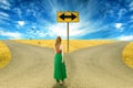 Young woman standing in front of two roads Royalty Free Stock Photo