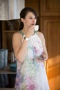 Young woman standing in kitchen and drinking coffe Royalty Free Stock Photo