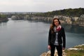 Young woman standing by lake