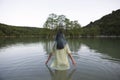 Young woman standing in lake Royalty Free Stock Photo